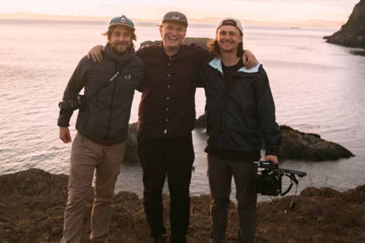 HWYONEPRO core production team standing next to the Ocean. Marshall Cody, Sam Loomis, and Brice Pardo